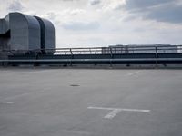 a boat is parked in an empty parking lot near an air port on the water
