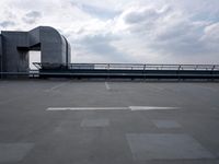 a boat is parked in an empty parking lot near an air port on the water