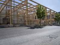 an image of a street in the city area with wood structures on it's walls