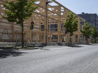 an image of a street in the city area with wood structures on it's walls