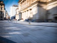 blurry picture taken from the front seat of a parked vehicle on an empty street