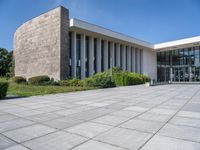 this is an image of a building with the stoned exterior and large windows on the side