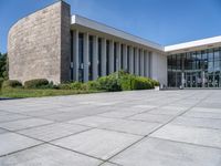 this is an image of a building with the stoned exterior and large windows on the side