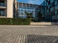 a street and sidewalk area that looks like a courtyard with building designs on each one