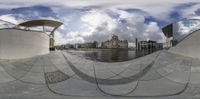 the fisheye image shows an outside area and water area, with a boat dock at one side