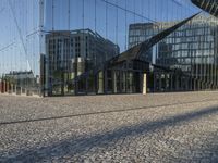 the reflection of an office building in a glass walled entryway is seen in a mirror - glass photo