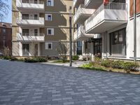 this is an image of a very quiet courtyard area outside a building which was built into a lot