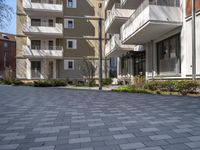 this is an image of a very quiet courtyard area outside a building which was built into a lot