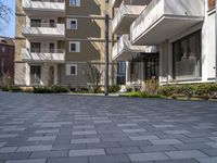 this is an image of a very quiet courtyard area outside a building which was built into a lot