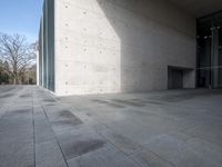 there is a concrete floor with a square pattern of stone that has rounded ridges and squares on it