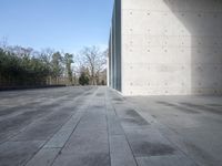 there is a concrete floor with a square pattern of stone that has rounded ridges and squares on it