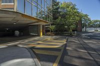 a parking garage with no cars or motorcycles parked on it's side outside in front of a building