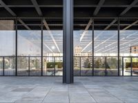 the large floor area is glass with windows looking out onto the courtyard and the trees