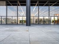 the large floor area is glass with windows looking out onto the courtyard and the trees