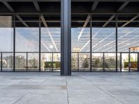 the large floor area is glass with windows looking out onto the courtyard and the trees