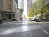 an empty city street filled with lots of tall buildings and plants growing on the sides