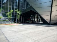 a large building has an entry way to it as a sign points out for you