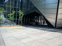 a large building has an entry way to it as a sign points out for you