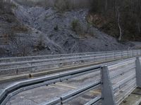 Gloomy Alps Landscape: Metal Bridge Across the Mountains