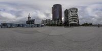 three high - rise buildings surround the city's circular view lenses in this time lapsure