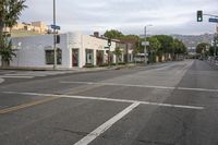 the empty streets are very quiet and deserted today at night, with cars coming around