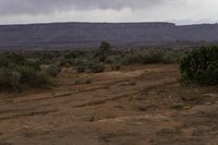 Gloomy Day in the Desert: Clouds Over Barren Landscape