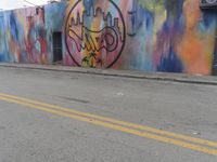 a wall has a painted logo with graffiti on it and the word, new york city