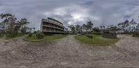 this photo shows a 360 - view of a hotel complex and surrounding gardens that is being constructed