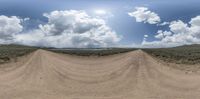 this is an image of the view from a motorcycle on a dirt trail in a desert