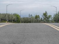 Gloomy Day with Yellow Lines on Asphalt Road