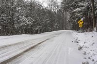 Gloomy Landscape in Canada, Ontario: Snowy Road Amidst a Grey Sky