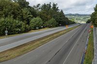 an empty freeway with two lanes going down it to the left and to the right