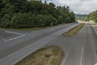 an empty freeway with two lanes going down it to the left and to the right