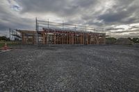 construction under construction is seen from the road and road side of a building being constructed