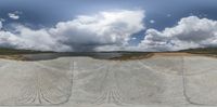 360 - fisheye photography of a landscape with trees and water in the background, taken from below