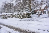 this street is completely covered in snow and it's a bit unwepahed