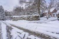 this street is completely covered in snow and it's a bit unwepahed