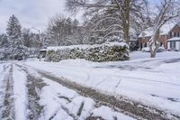 this street is completely covered in snow and it's a bit unwepahed