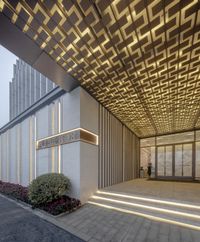 the entrance to the residence hotel in downtown los is lit up in gold to welcome travelers