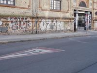 the street has been tagged with graffiti for good reason by the law that it is
