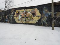 Graffiti Art on a Snowy Wall in Detroit