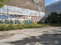 a parking lot has been graffited with graffiti from the past and is empty