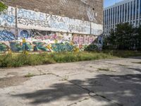 a parking lot has been graffited with graffiti from the past and is empty