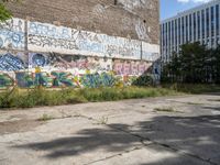 a parking lot has been graffited with graffiti from the past and is empty