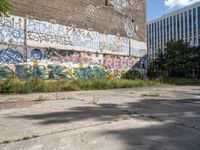 a parking lot has been graffited with graffiti from the past and is empty