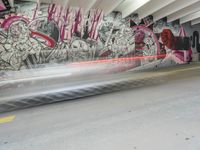 graffiti depicting people walking in an underground parking lot of a building while others walk past