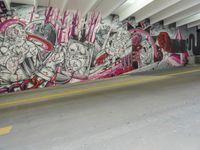 graffiti depicting people walking in an underground parking lot of a building while others walk past