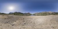 a fisheye lens view of the landscape surrounding a lake and mountains in greece and greece