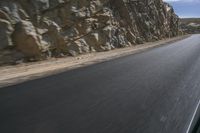 Grey Asphalt Road in African Landscape with Mountain