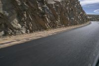 Grey Asphalt Road in African Landscape with Mountain